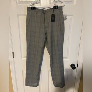Greg Norman brand new golf pants. Gray plaid. Size 32x32.